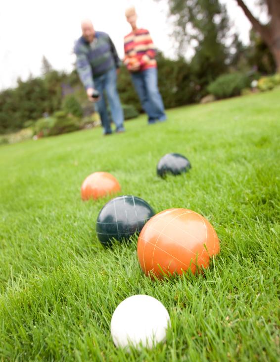 Elderly couple playing Bocce ball